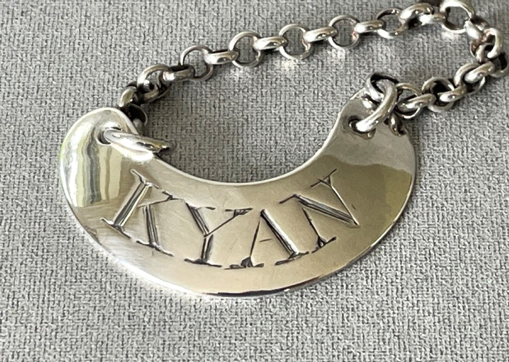 A rare 18th Century silver 'Kyan' bottle ticket