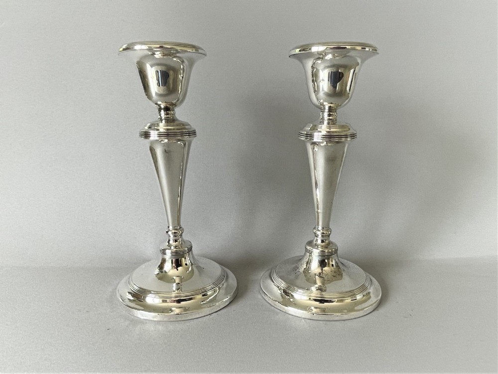 A Handsome Pair Of Edwardian Silver Candlesticks
