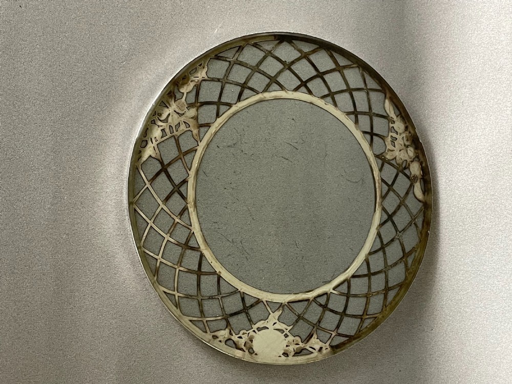 A lovely Sterling silver pierced teapot stand or coaster View V