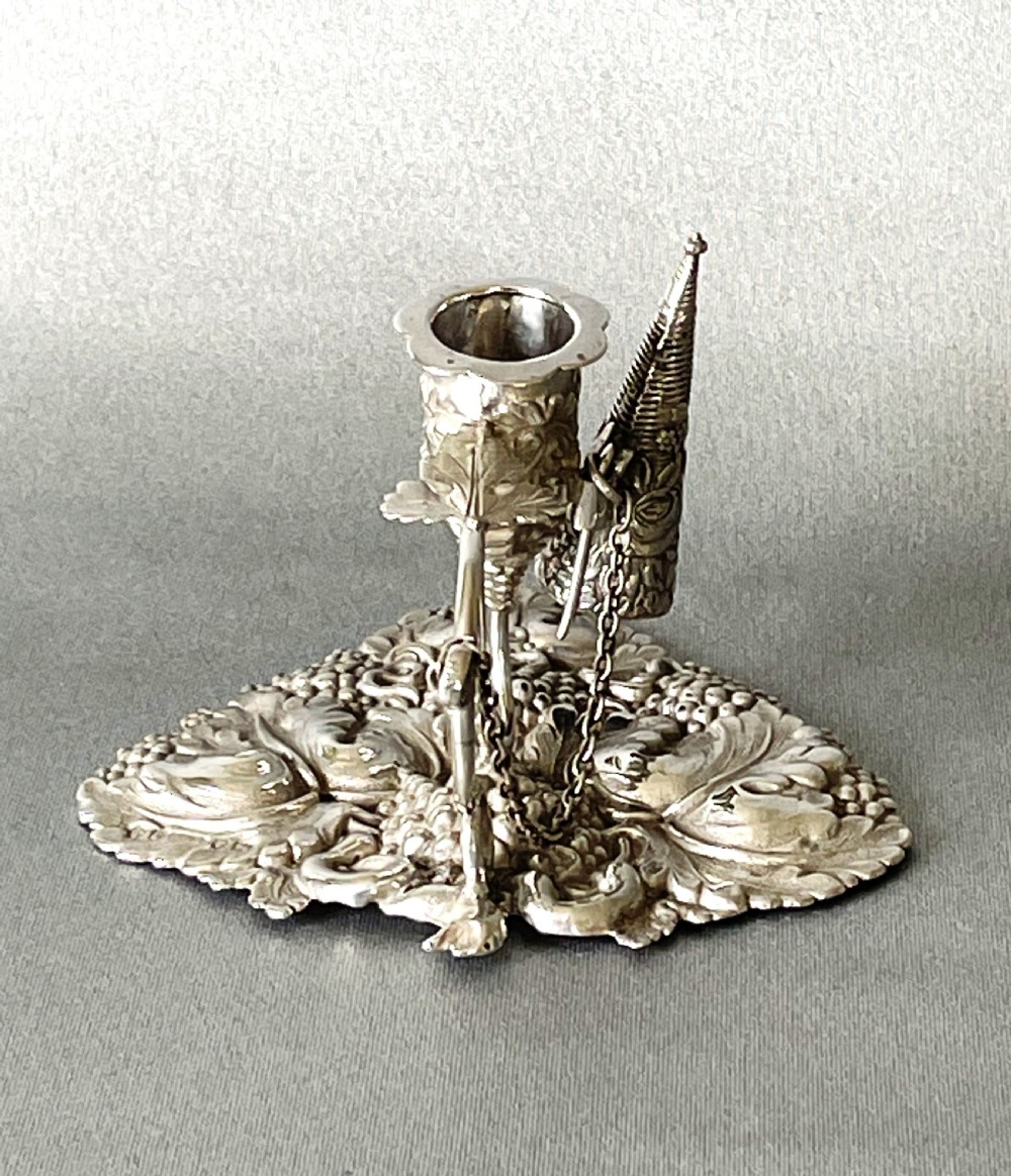 A delightful Georgian small silver chamber stick View II