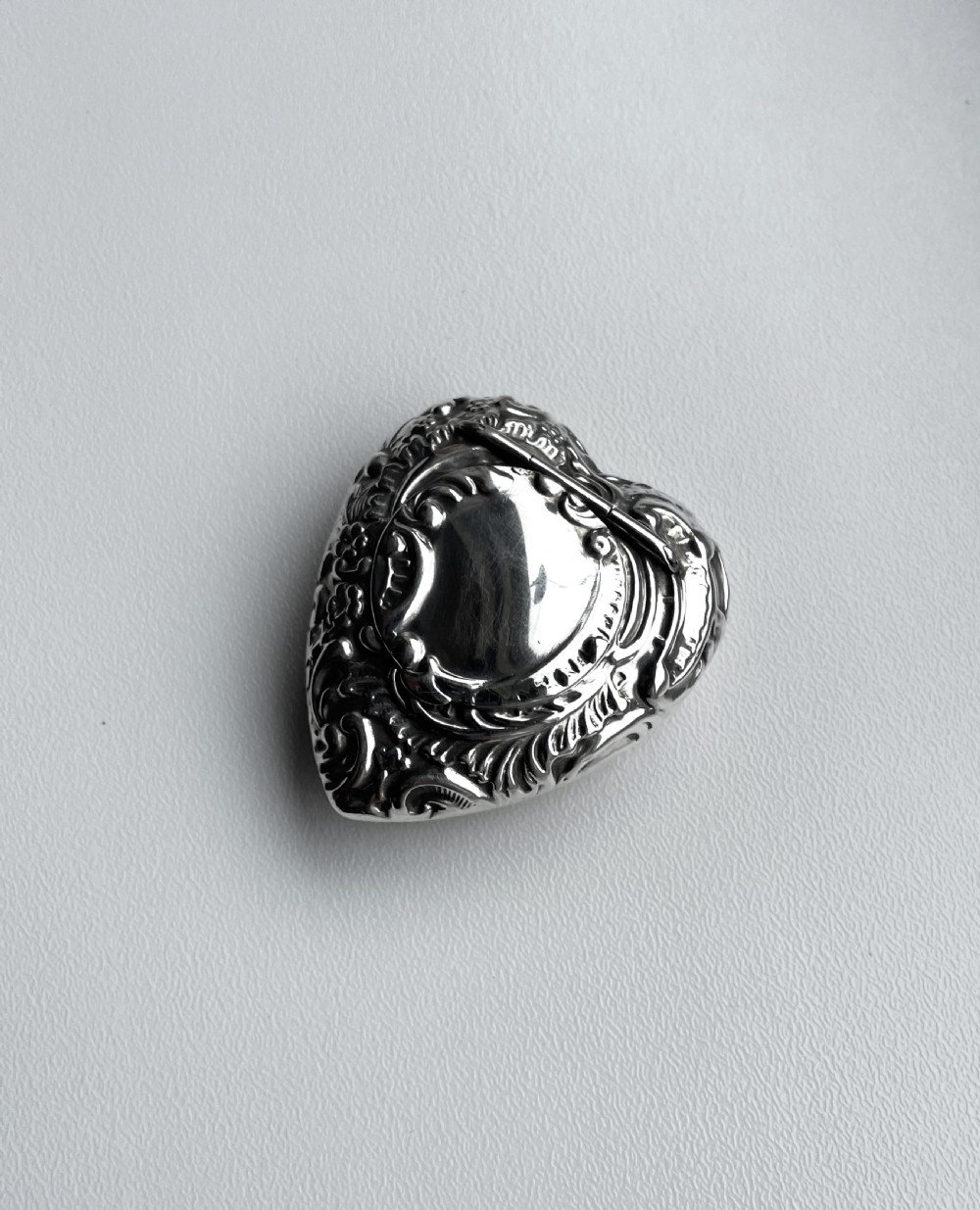 A Victorian novelty heart shaped silver pill box
