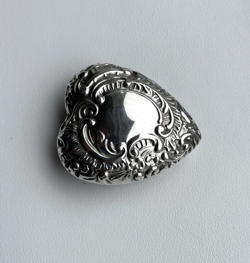 A Victorian novelty heart shaped silver pill box View II