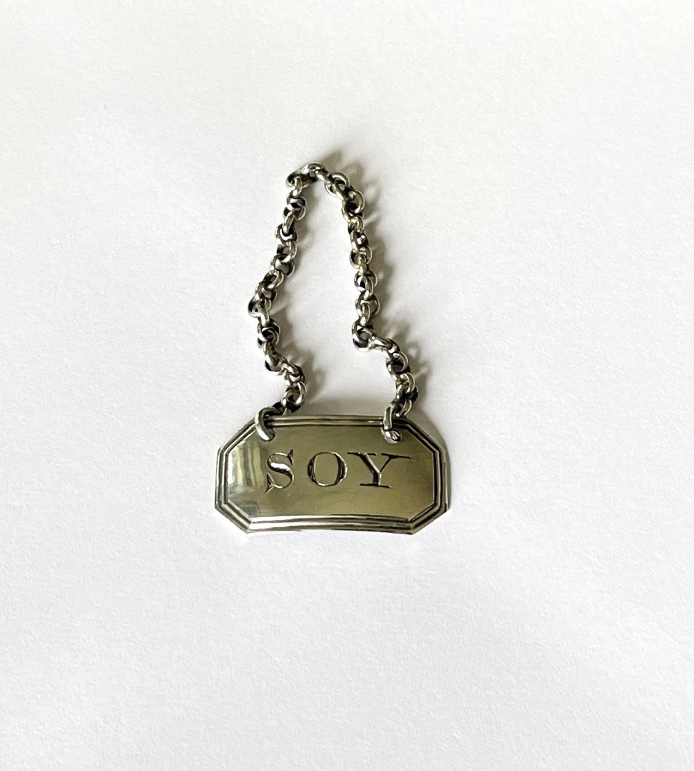 A fine Georgian silver 'Soy' bottle ticket