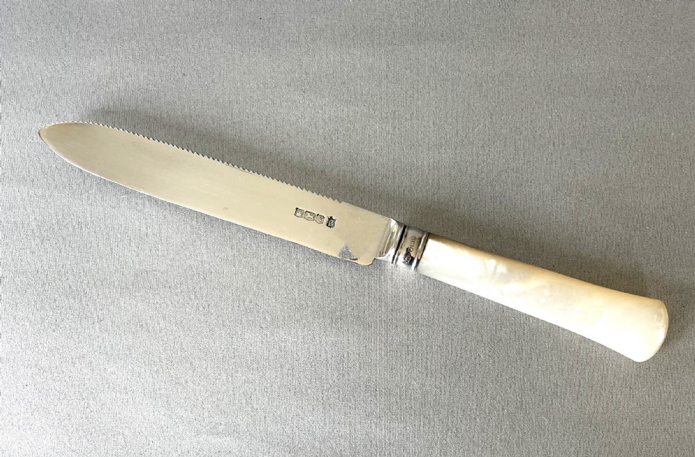 A stylish silver & mother-of-pearl cake knife