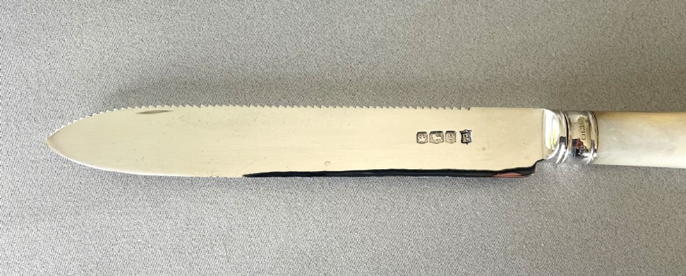 A stylish silver & mother-of-pearl cake knife View III