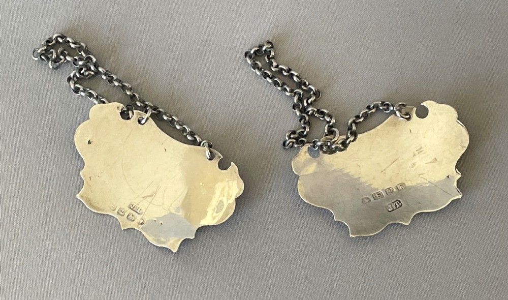 A desirable pair of Victorian silver Rum & Gin decanter labels View IV