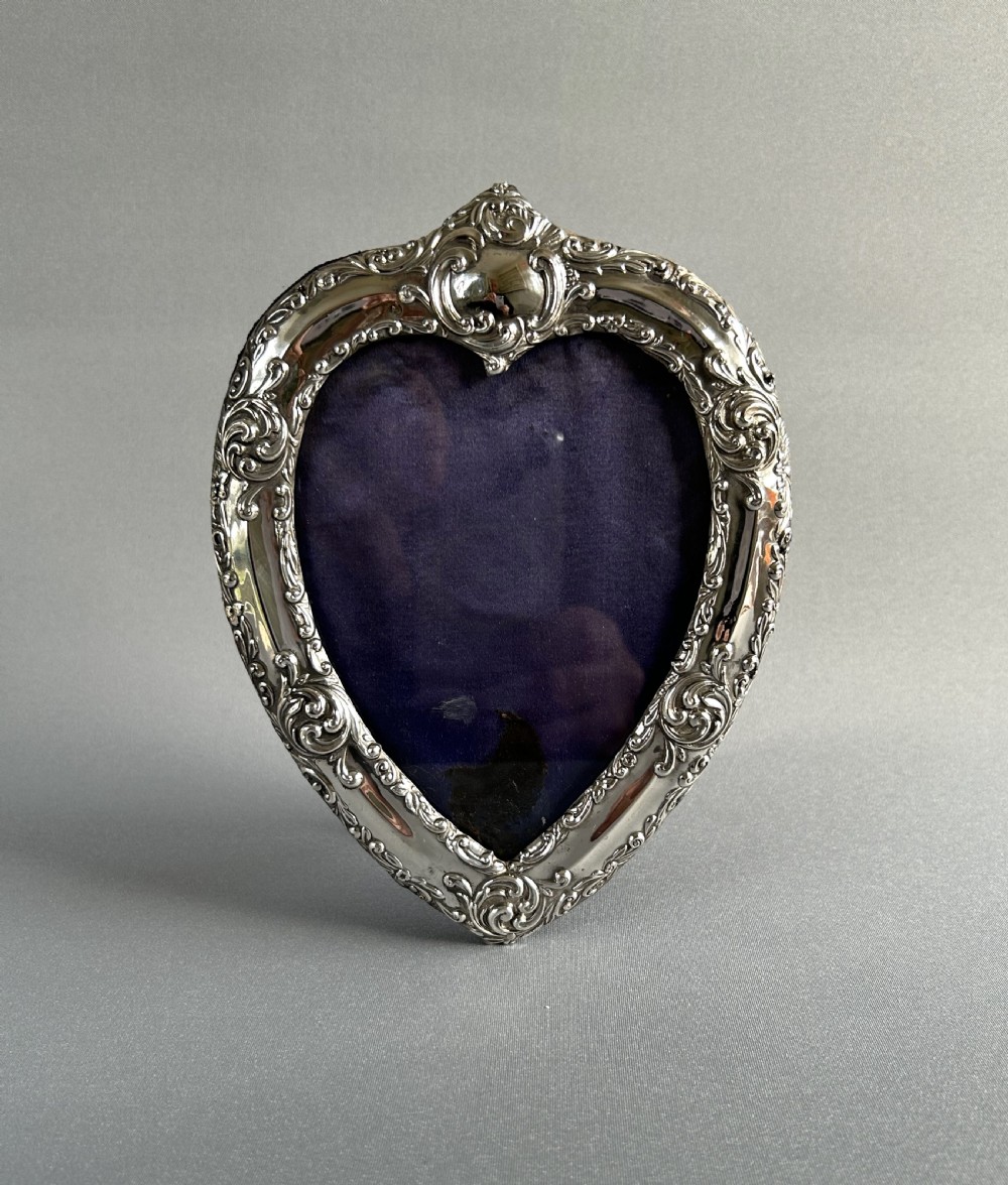 A lovely Victorian heart shaped silver photo frame