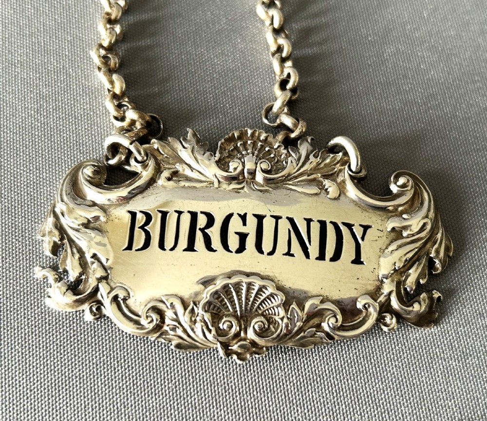 A superb set of 3 early Victorian silver decanter labels View III