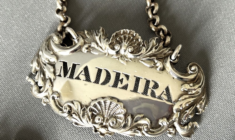A superb set of 3 early Victorian silver decanter labels View IV