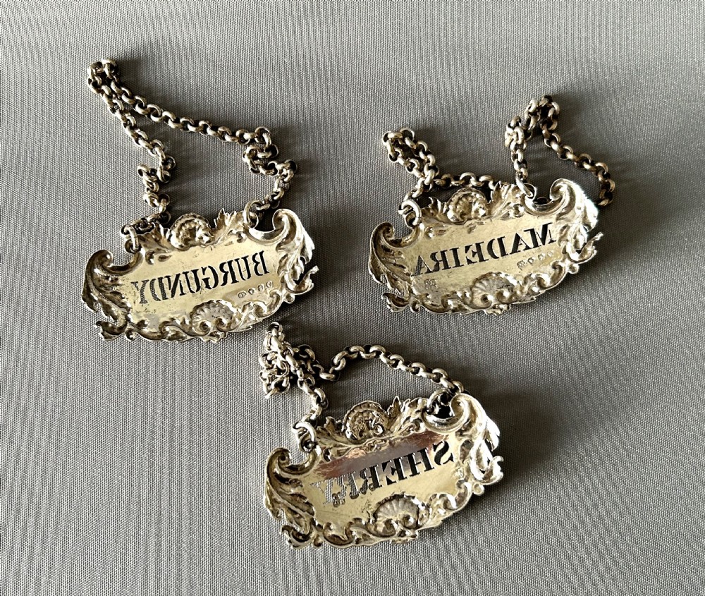 A superb set of 3 early Victorian silver decanter labels View V