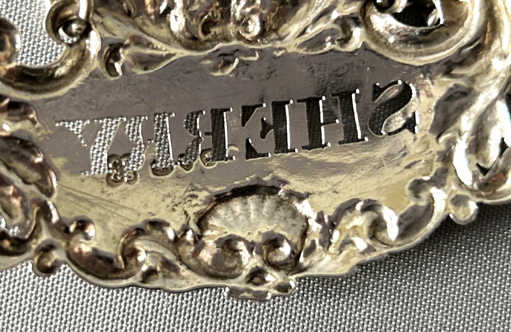 A superb set of 3 early Victorian silver decanter labels View VII
