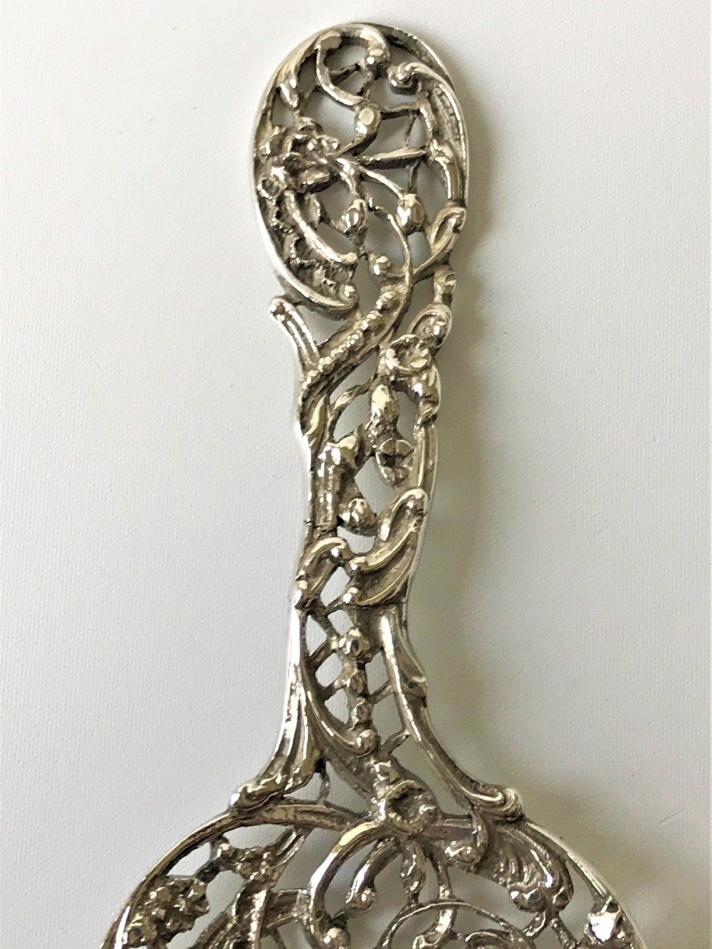 A lovely William Comyns Victorian cast silver bonbon spoon View III