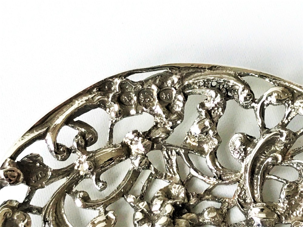 A lovely William Comyns Victorian cast silver bonbon spoon View V