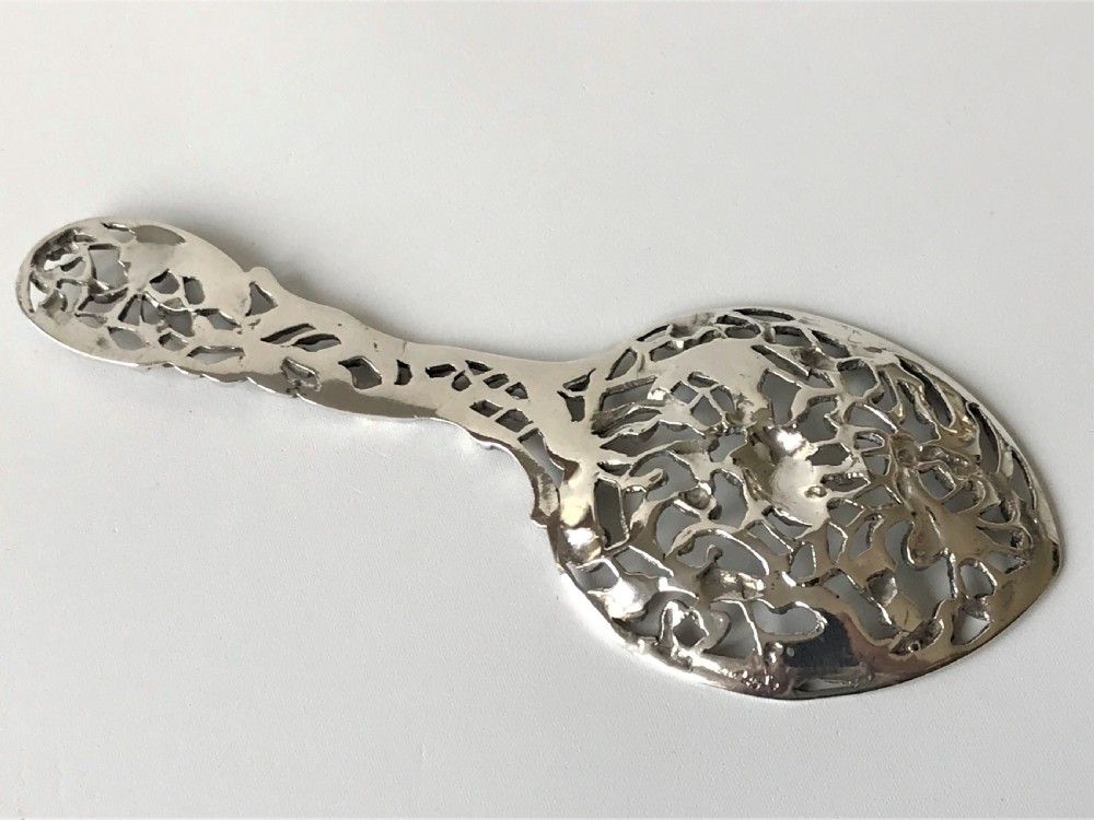 A lovely William Comyns Victorian cast silver bonbon spoon View VII