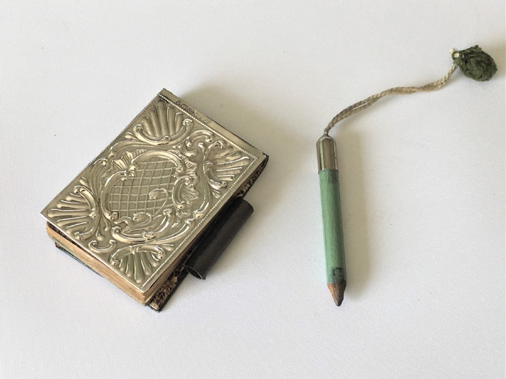 A charming Edwardian silver fronted notebook View VII