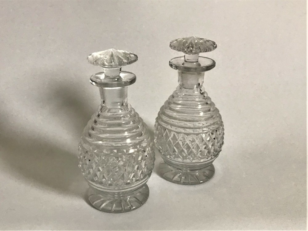 A gorgeous pair of Georgian cut glass cologne bottles