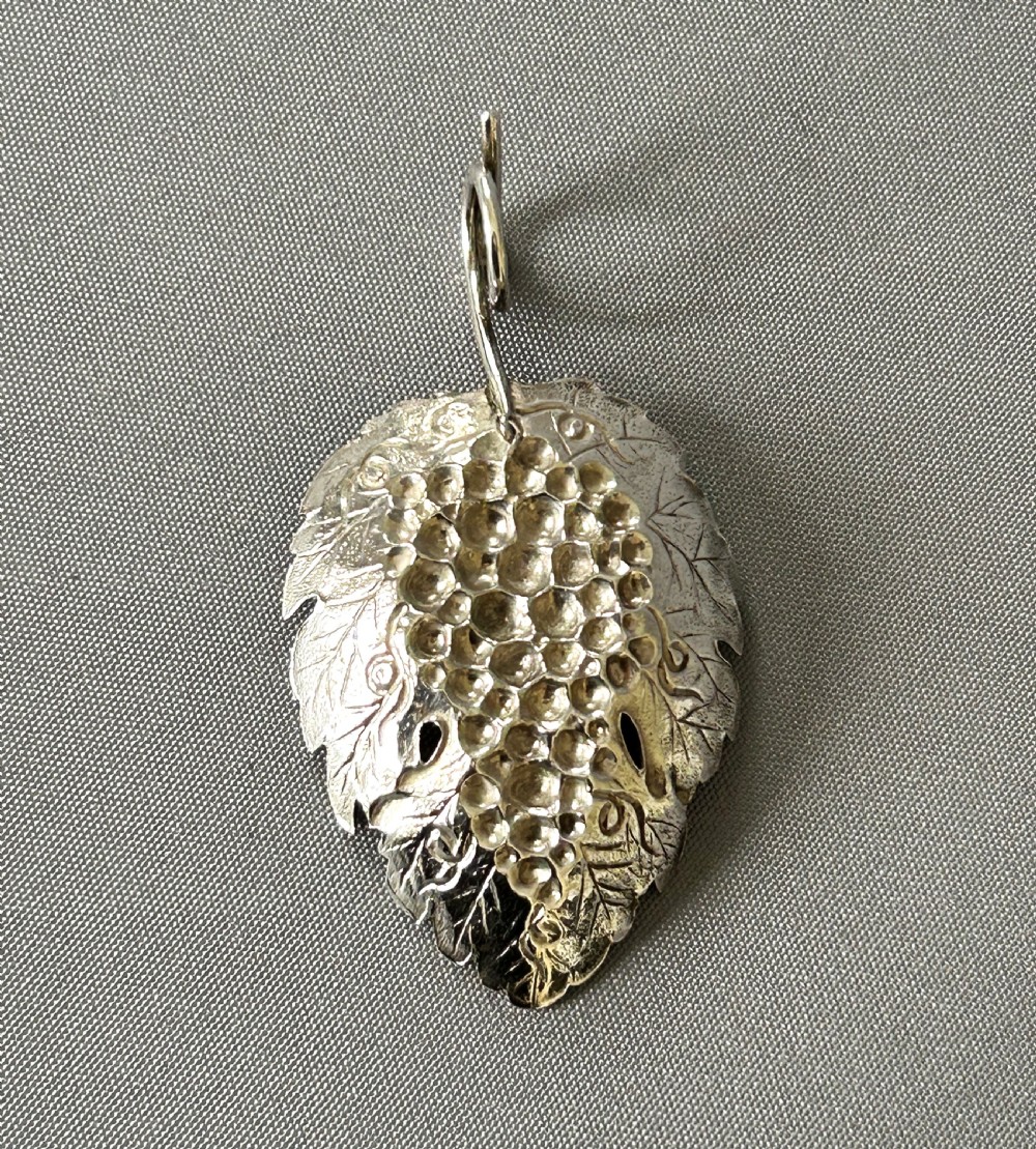 A desirable Georgian silver leaf caddy spoon View III