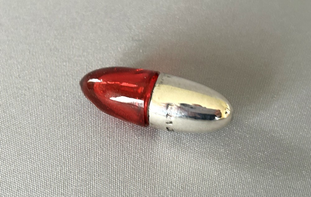 A Victorian novelty silver & cranberry glass 'bullet' scent bottle