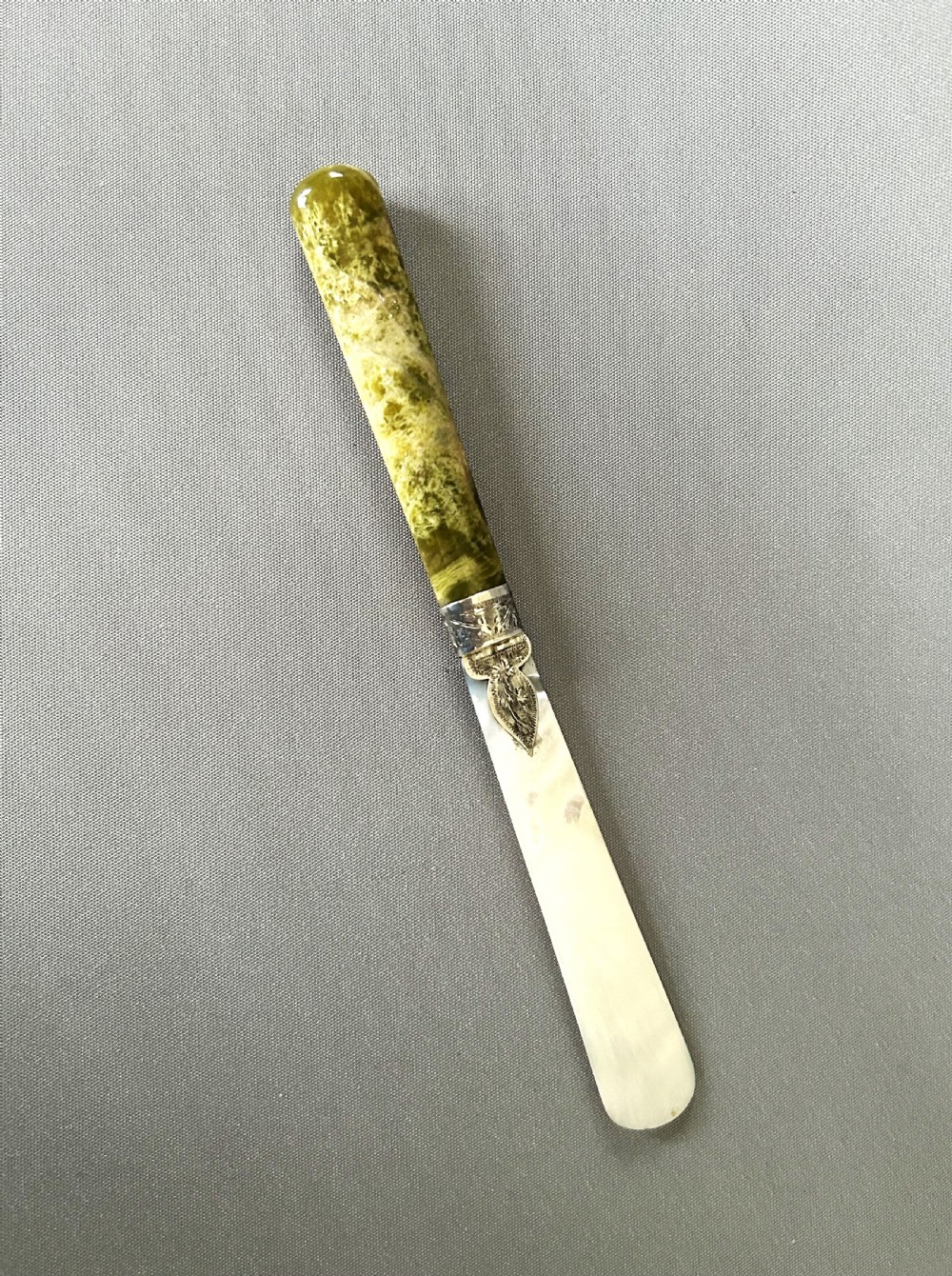 A stunning silver mounted agate & mother-of-pearl letter opener