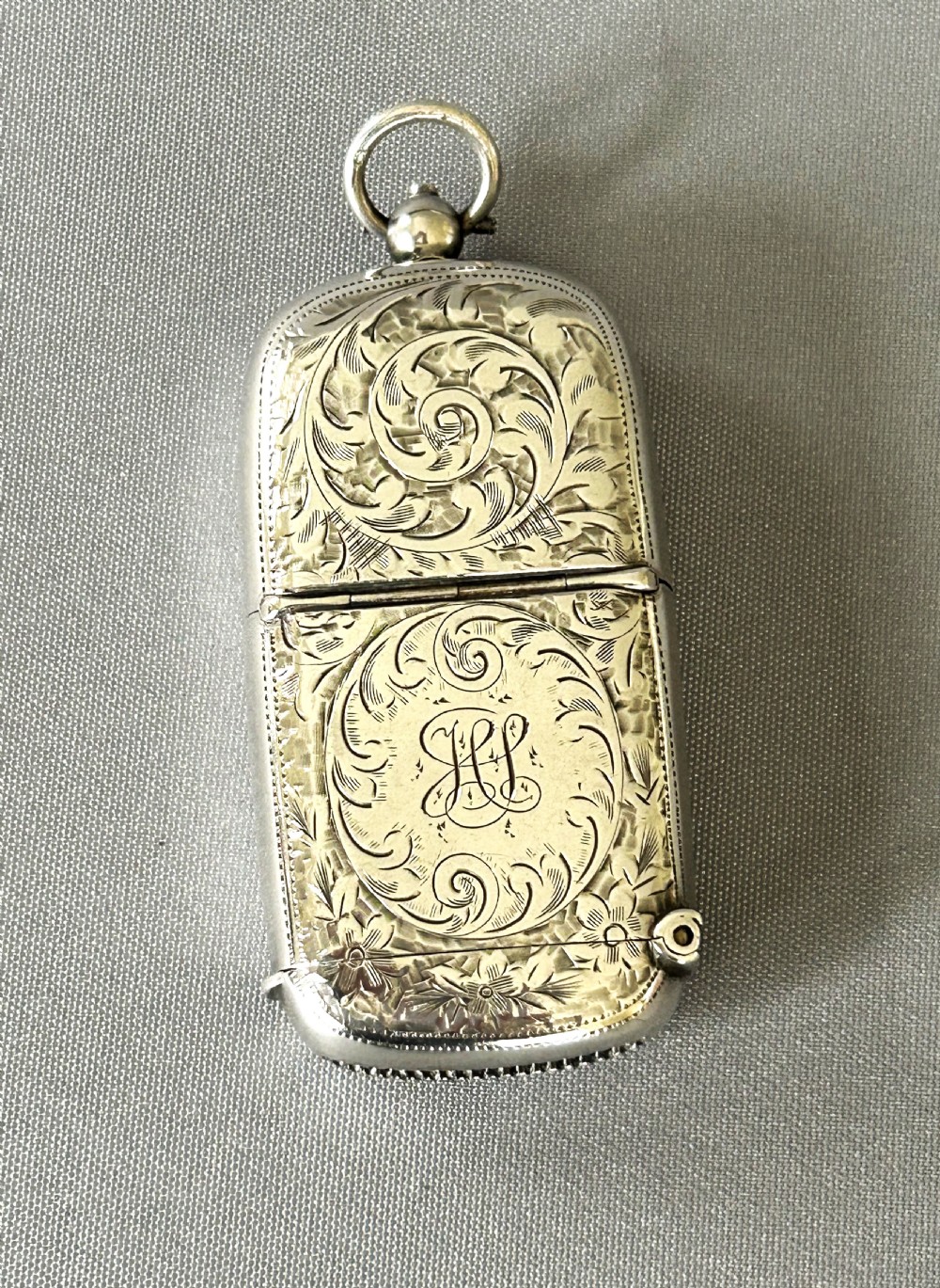 A superb Edwardian silver vesta/sovereign case combo
