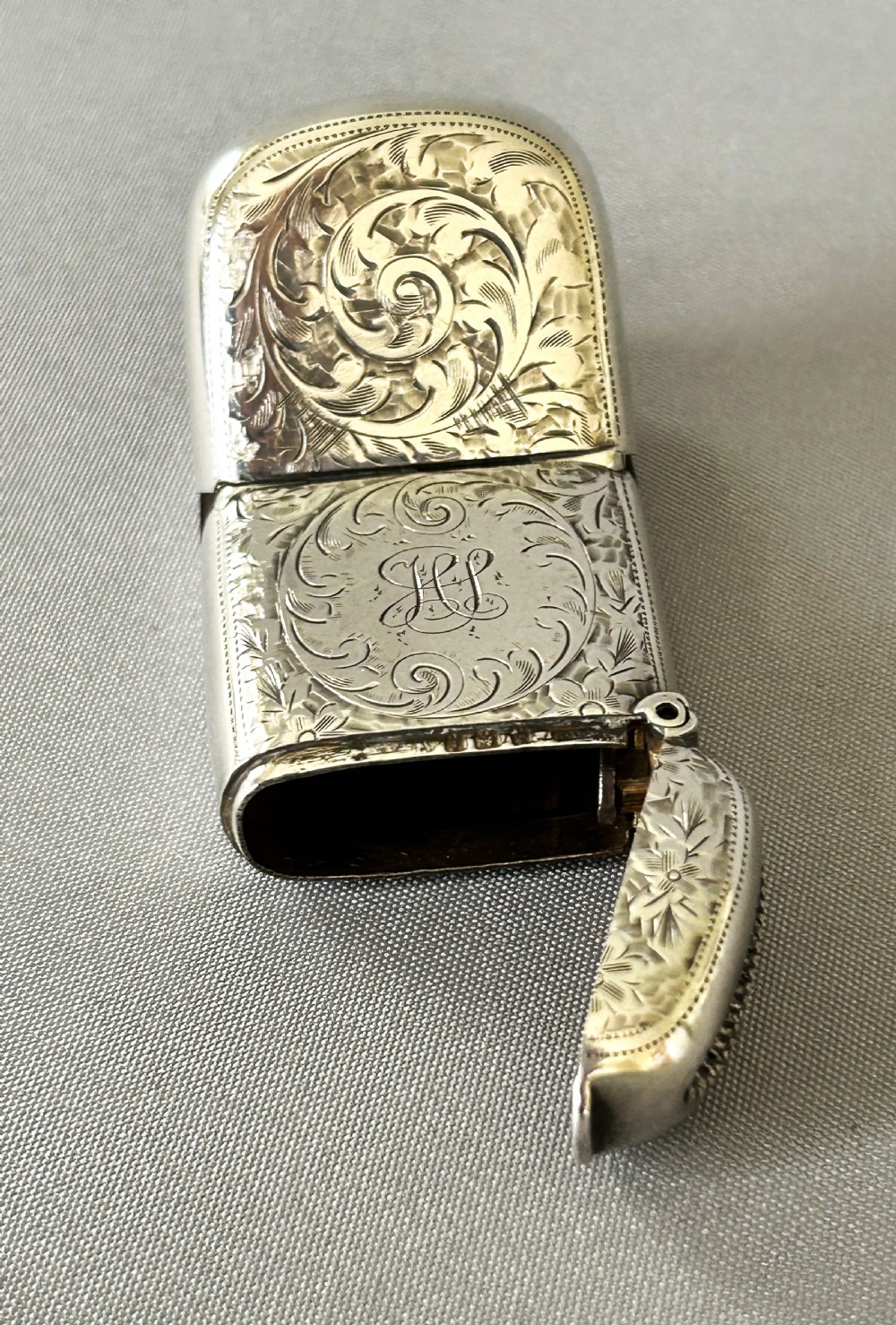 A superb Edwardian silver vesta/sovereign case combo View V