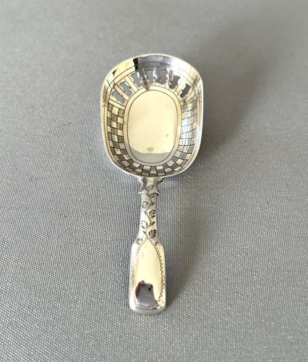 An unusual Georgian pierced bowl caddy spoon