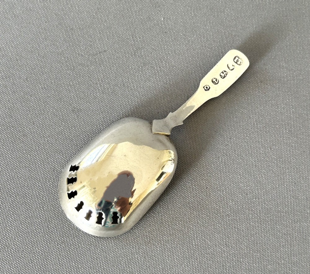An unusual Georgian pierced bowl caddy spoon View III
