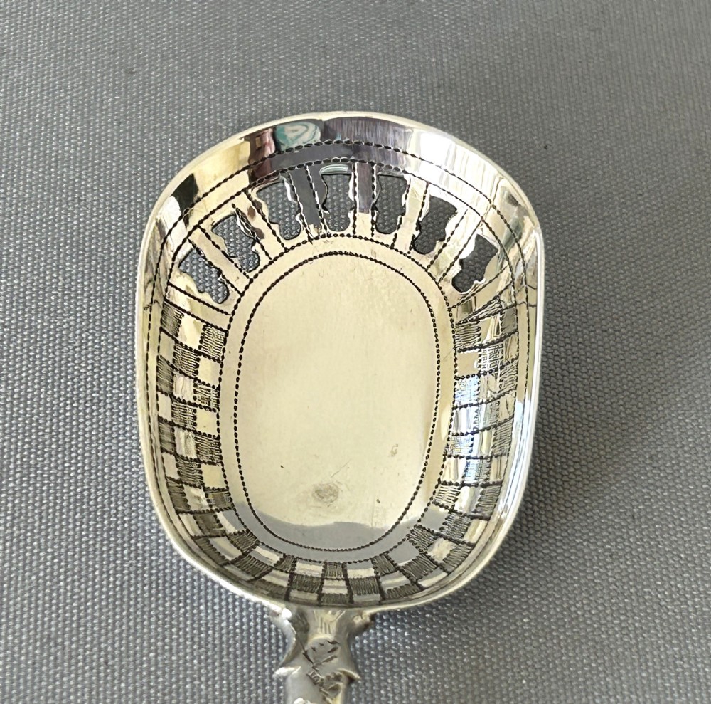 An unusual Georgian pierced bowl caddy spoon View V