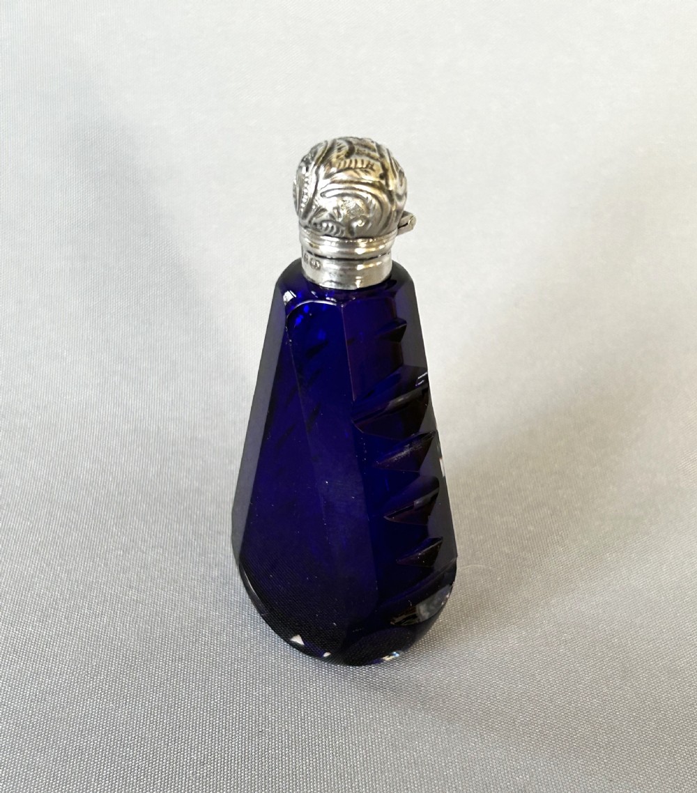 An unusual Victorian silver mounted scent bottle in Bristol Blue