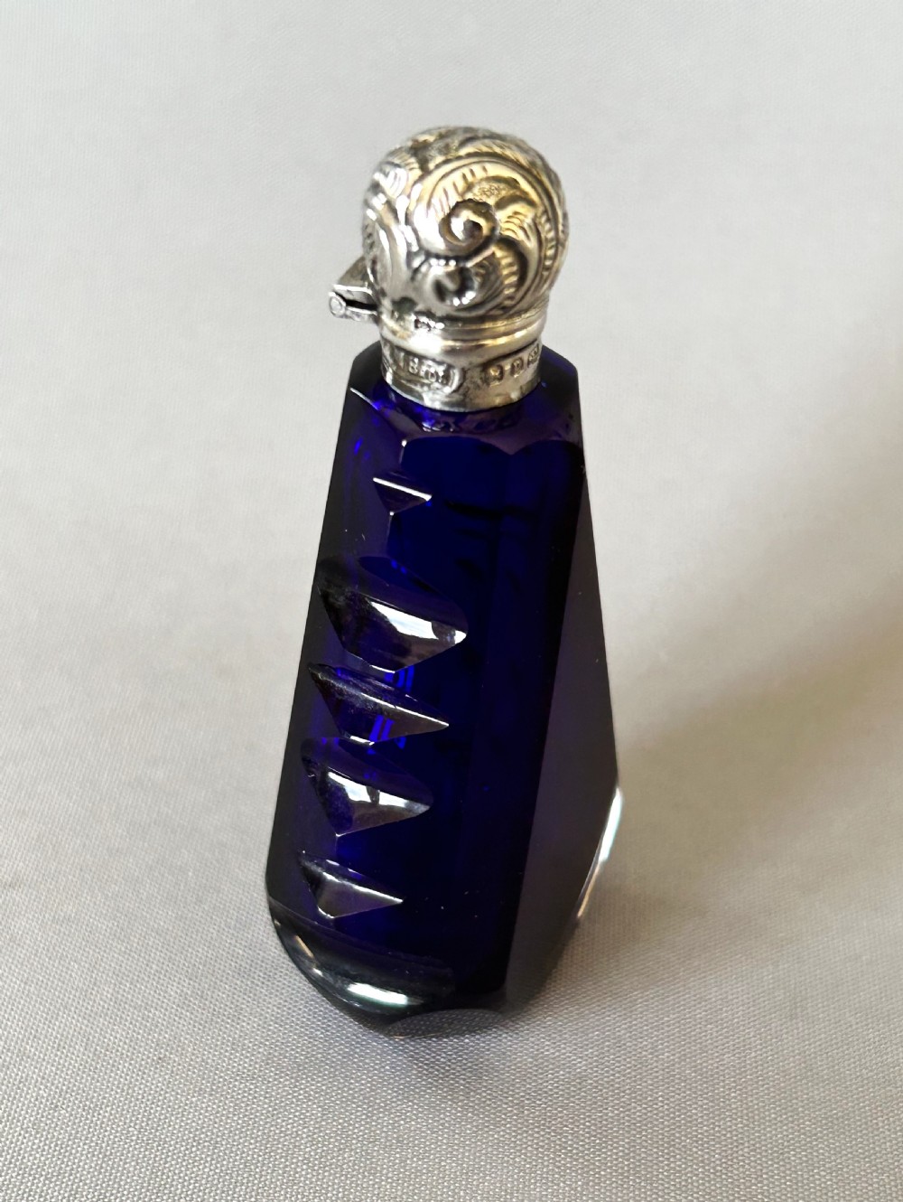 An unusual Victorian silver mounted scent bottle in Bristol Blue View II