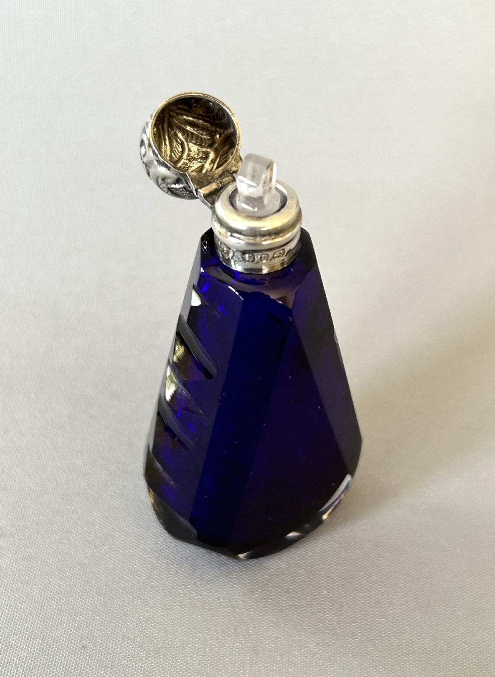An unusual Victorian silver mounted scent bottle in Bristol Blue View IV