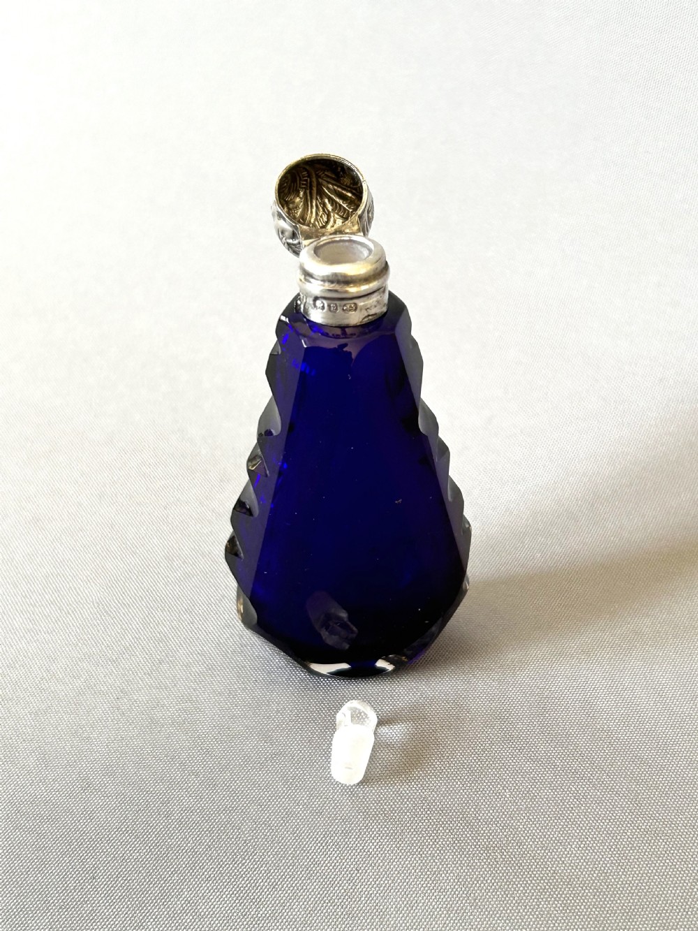 An unusual Victorian silver mounted scent bottle in Bristol Blue View V