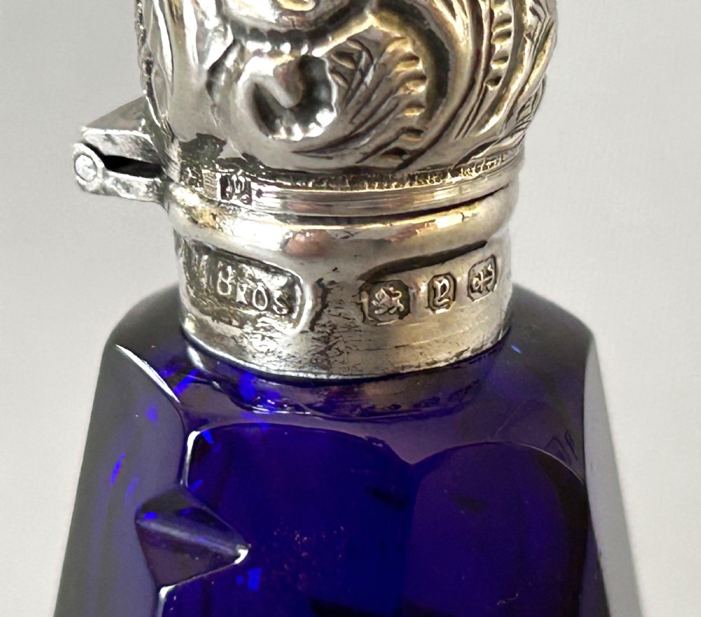 An unusual Victorian silver mounted scent bottle in Bristol Blue View VI