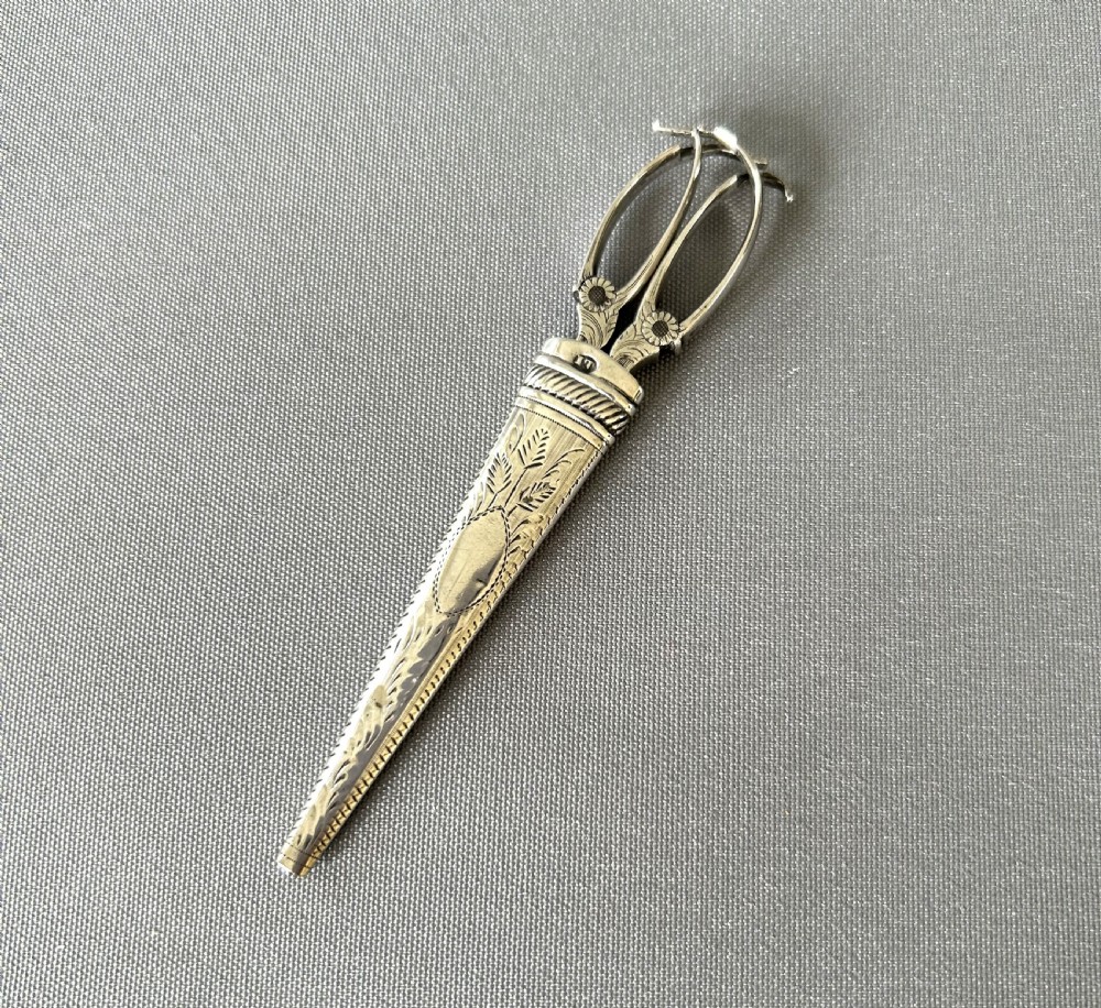 An exquisite pair of Georgian silver cased sewing scissors