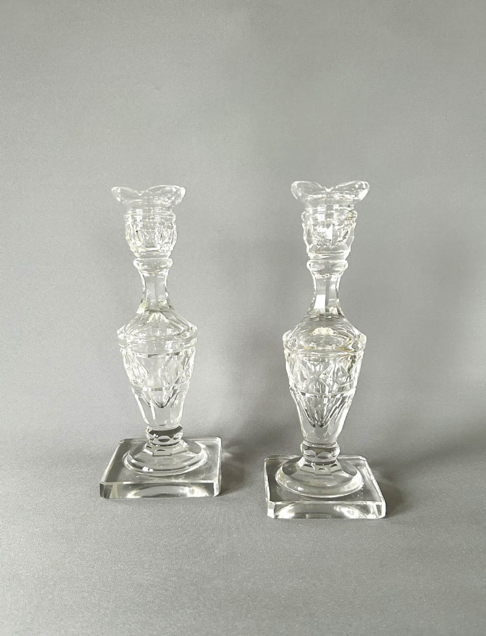 A lovely pair of Georgian revival cut glass candle sticks