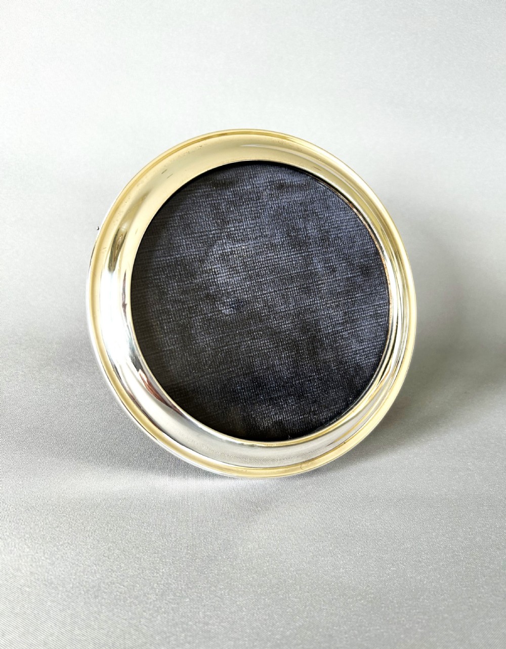 A Circular silver photo frame View IV