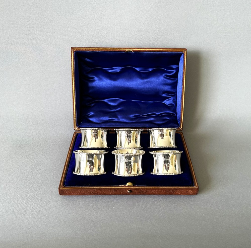 A handsome set of 6 boxed and numbered silver napkin rings