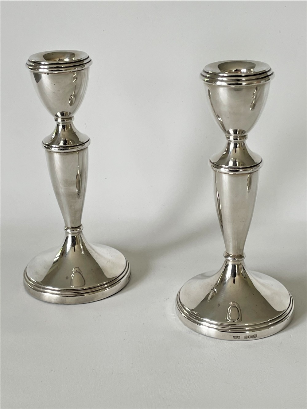 An unusual set of 4 hallmarked silver candlesticks View VI
