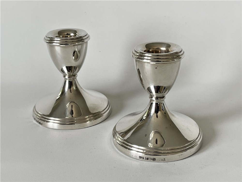 An unusual set of 4 hallmarked silver candlesticks View VII