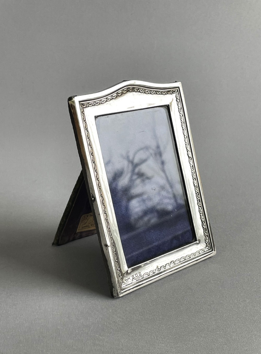 A charming George V small silver photo frame