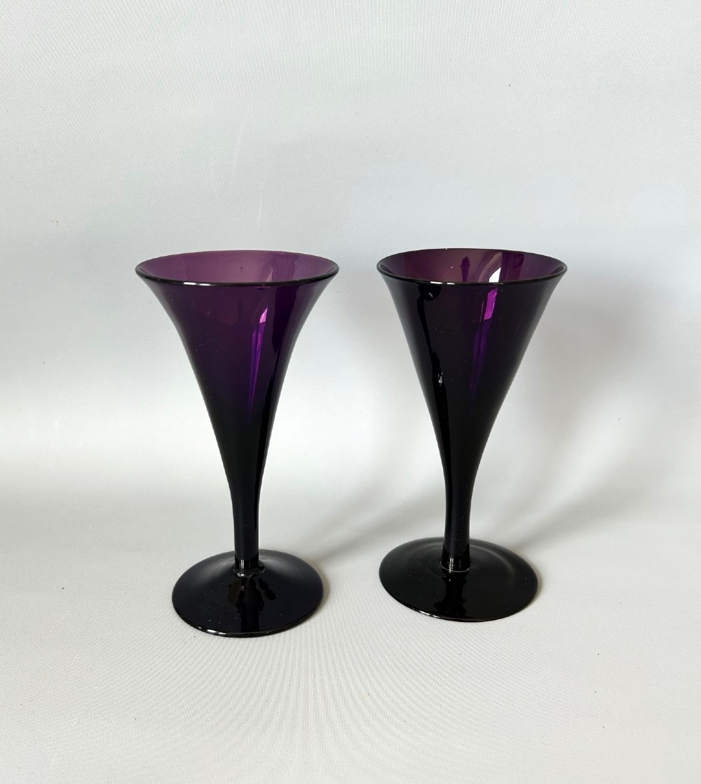 A pair of Georgian amethyst glass wine flutes