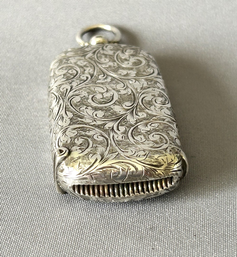 A collectible Victorian silver sovereign case/vesta combo View XI