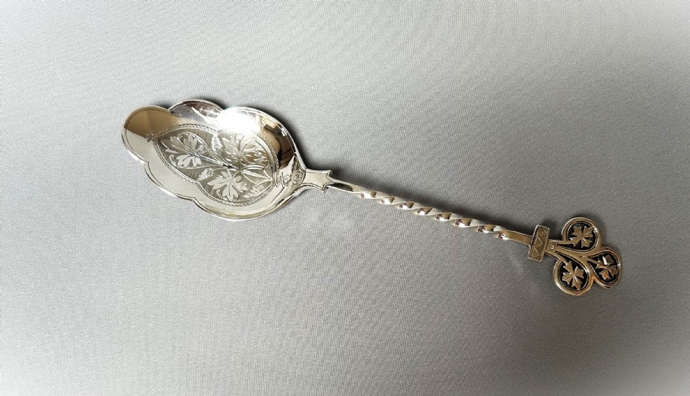 A gorgeous Victorian cast silver dessert/fruit serving spoon