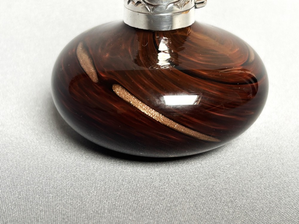 An unusual Edwardian silver mounted gold flecked scent bottle View III