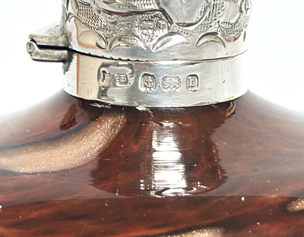 An unusual Edwardian silver mounted gold flecked scent bottle View VIII