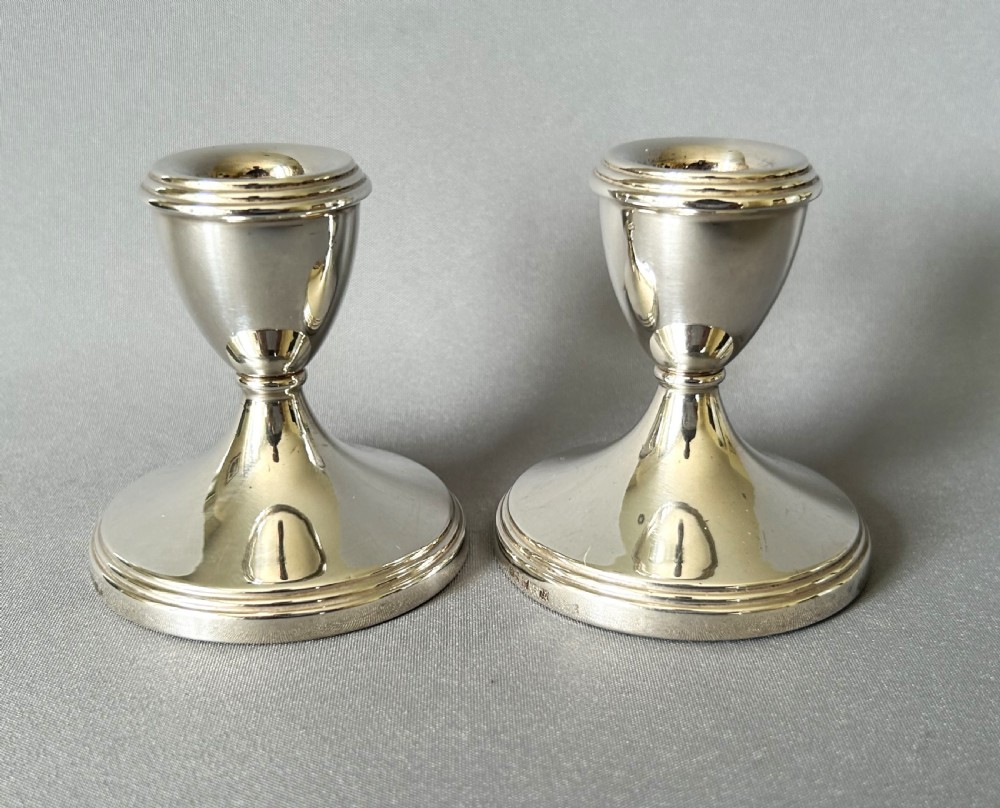 A charming pair of silver dwarf candlesticks View II