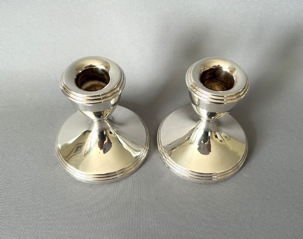 A charming pair of silver dwarf candlesticks View III