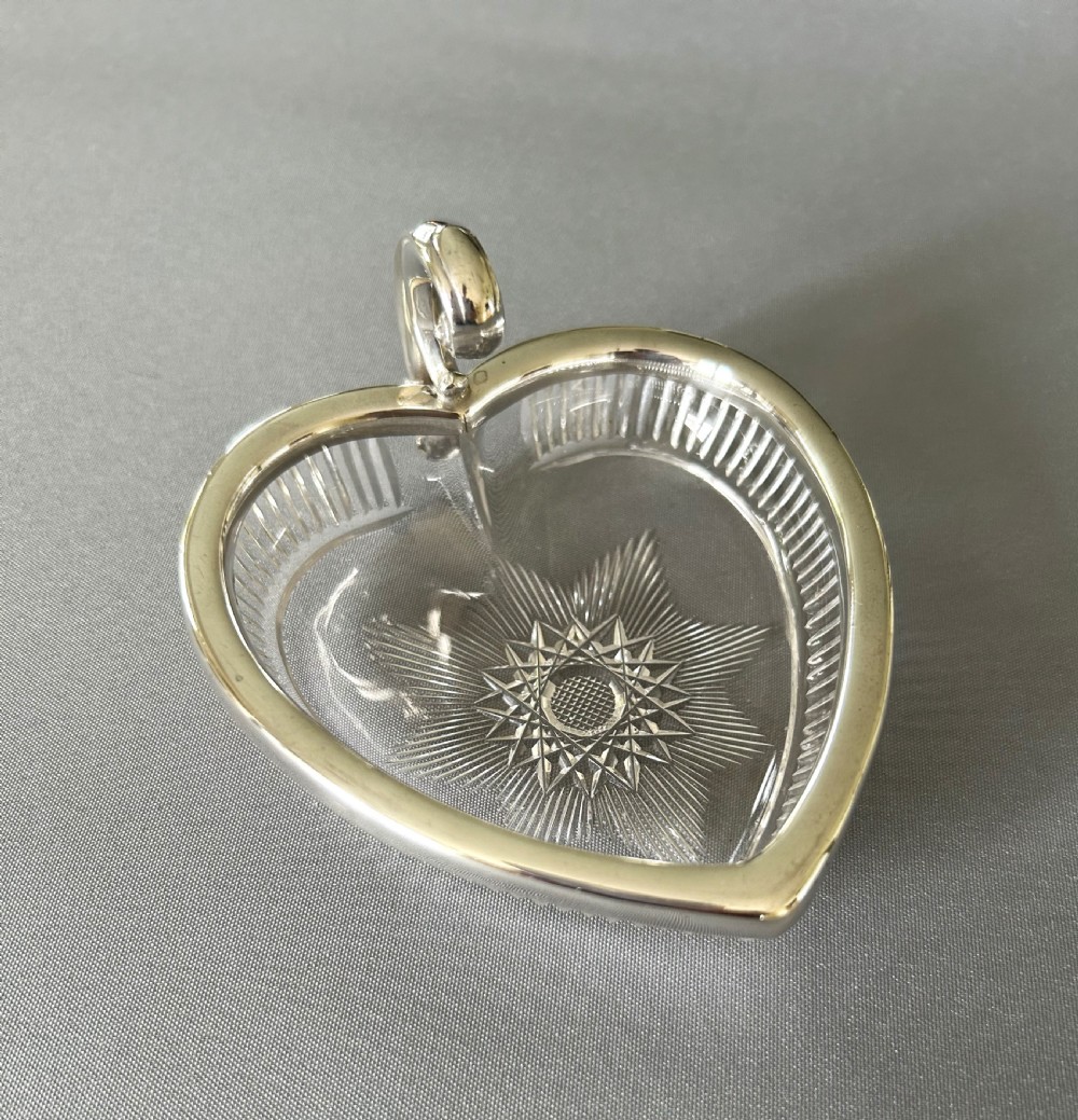 An Edwardian Chester silver & cut glass heart shaped dish
