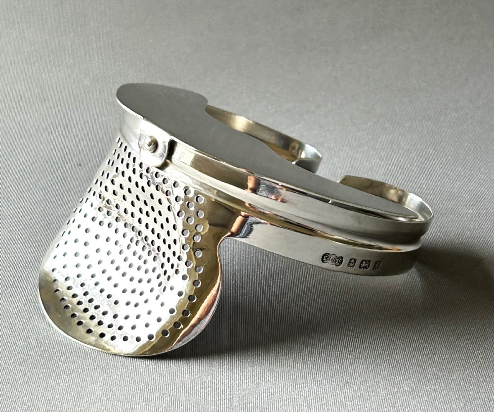 Extremely rare Edwardian silver ice strainer