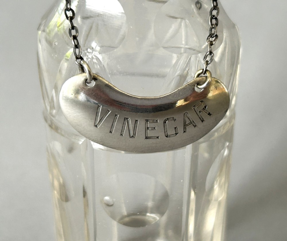 An unusual Edwardian cut glass vinegar bottle & silver label View III
